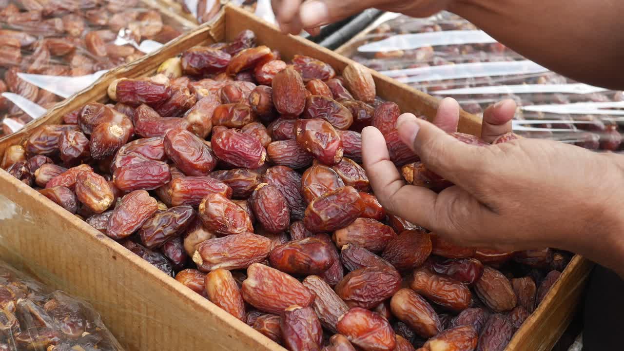 Many date fruits display for sale at local market