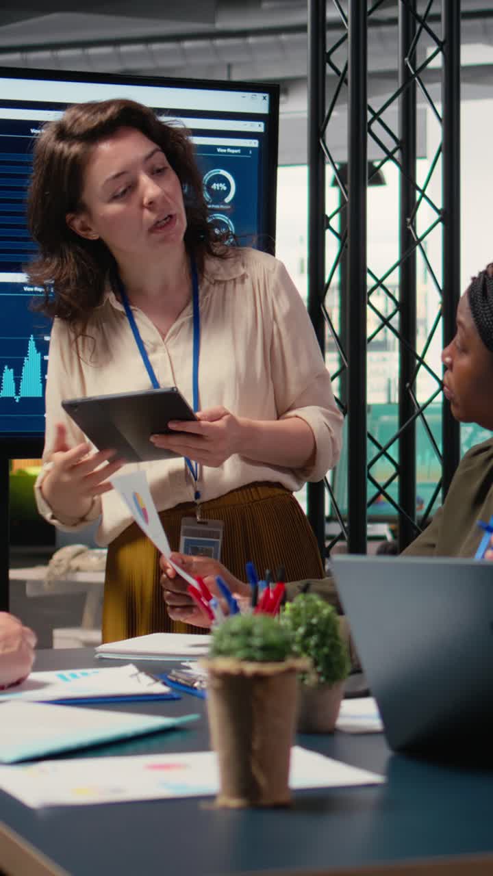 Vertical Video Businesswomen in a meeting symbolizing productivity in modern office