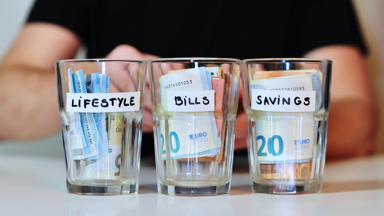 Counting money from labeled glass as part of personal savings, spending system