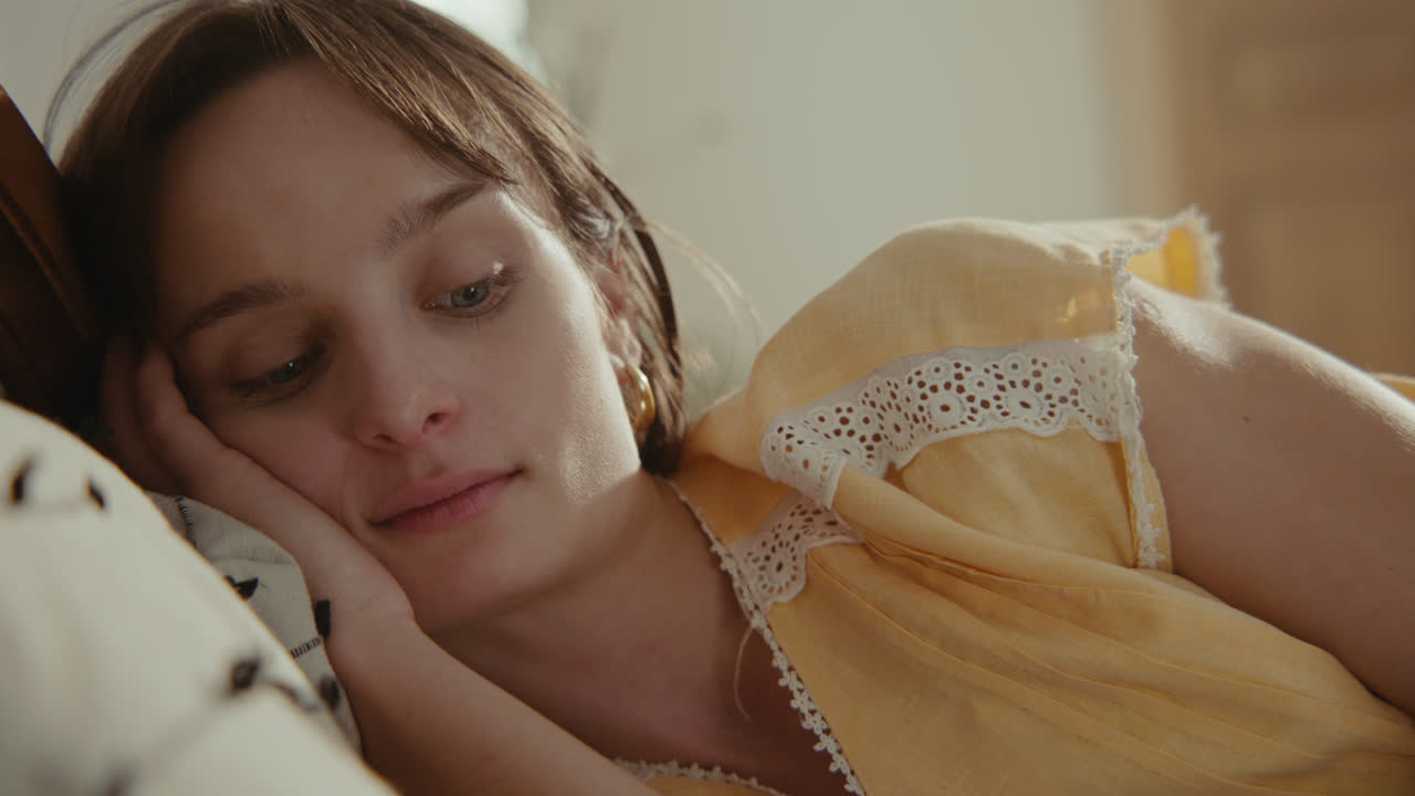A girl playing with dolls in her room