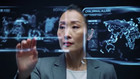 businesswoman interacting with a global holographic projection