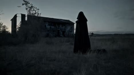 mysterious figure at an abandoned house at dusk