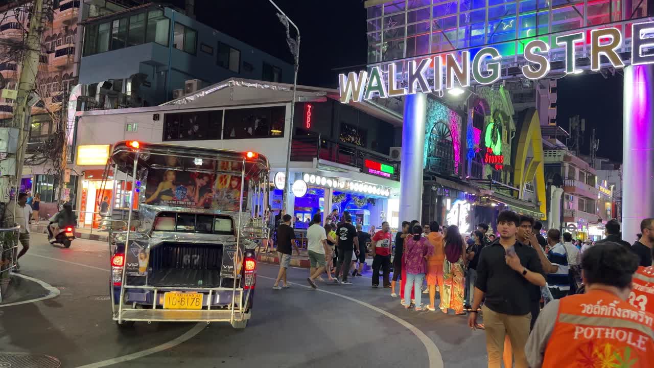 Vibrant Nightlife on a Busy City Street