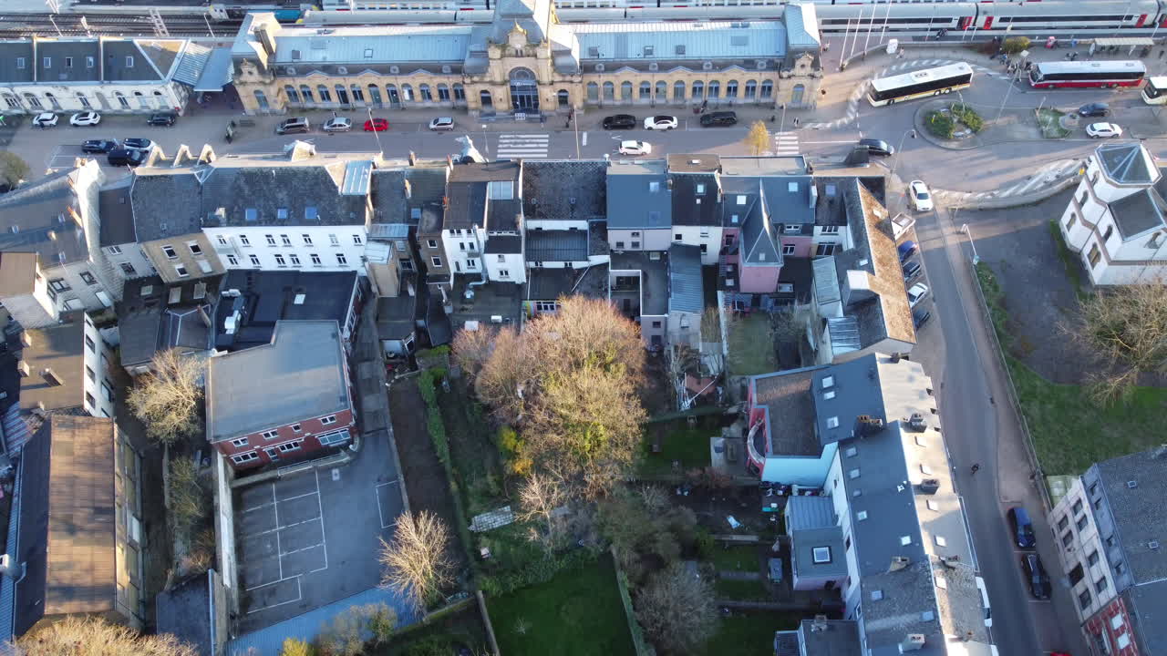 Aerial view of a European city with a train station