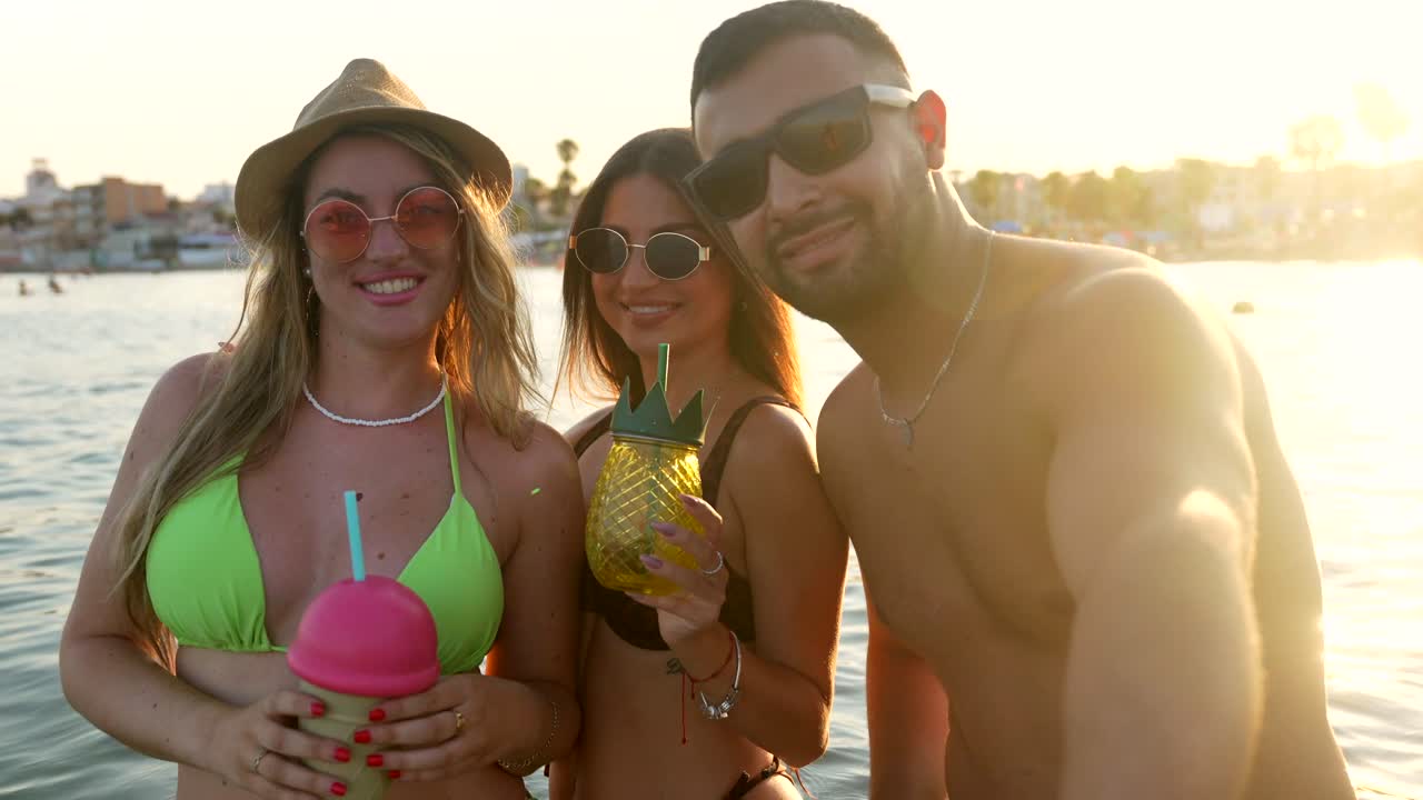 Friends enjoying summer vacation on the beach