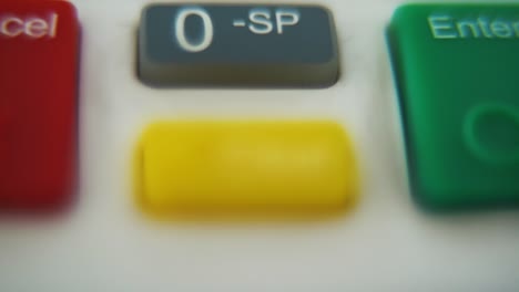 a macro close up shot of a pin pad numbers and letters on colorful buttons, smooth tilt down movement, full hd video, super slow motion, blurry depth of field