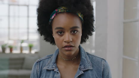 beautiful young african american woman portrait of cute trendy black girl looking pensive serious at camera