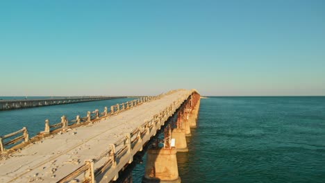 Post-apocalyptic-look-and-feel-through-aerial-of-old-over-the-water-road-in-the-Key-islands