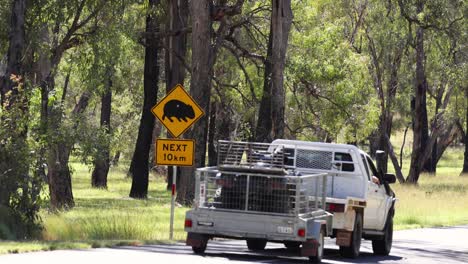 pickup truck towing an atv on a trailer