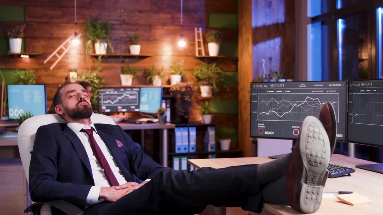 Businessman sleeping at his office desk