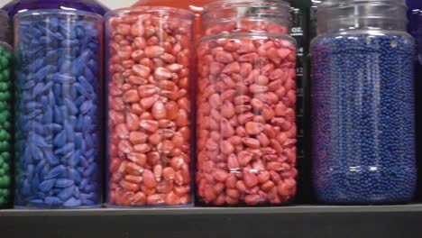 Jars-of-color-treated-soybean-and-corn-seeds-at-an-ag-science-lab