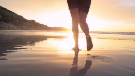 woman walking on beach barefoot sunset steadicam shot