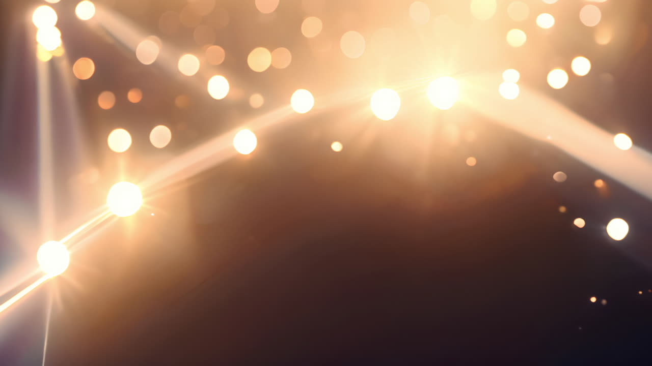 animación de partículas y haces de luz brillantes sobre un fondo oscuro