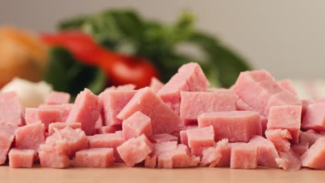 ham italian mordatella, man slices of traditional italian antipasti mortadella sausage on a wooden cutting board, close up macro of chicken or turkey jamon, fat breakfast dish.