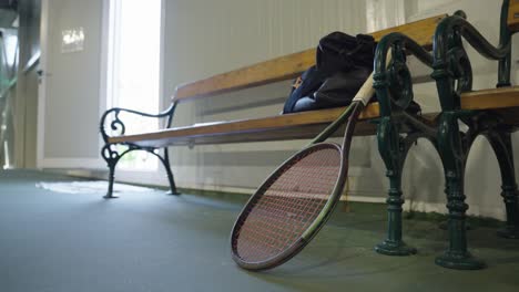 tennis racket on the bench