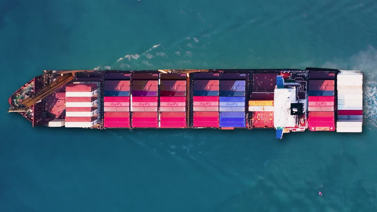 Container ship carrying cargo across trade routes under clear skies