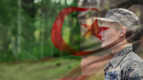 animation of flag of algeria over caucasian male soldier saluting