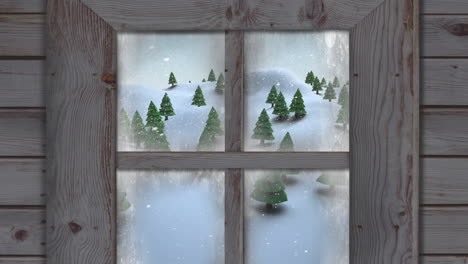 wooden window frame against snow falling over multiple trees on winter landscape