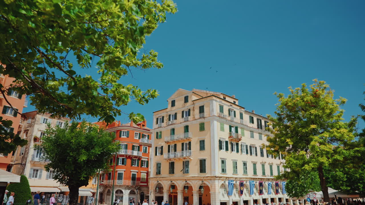 Bustling City Square with Historic Architecture and Pedestrians on a Sunny Day