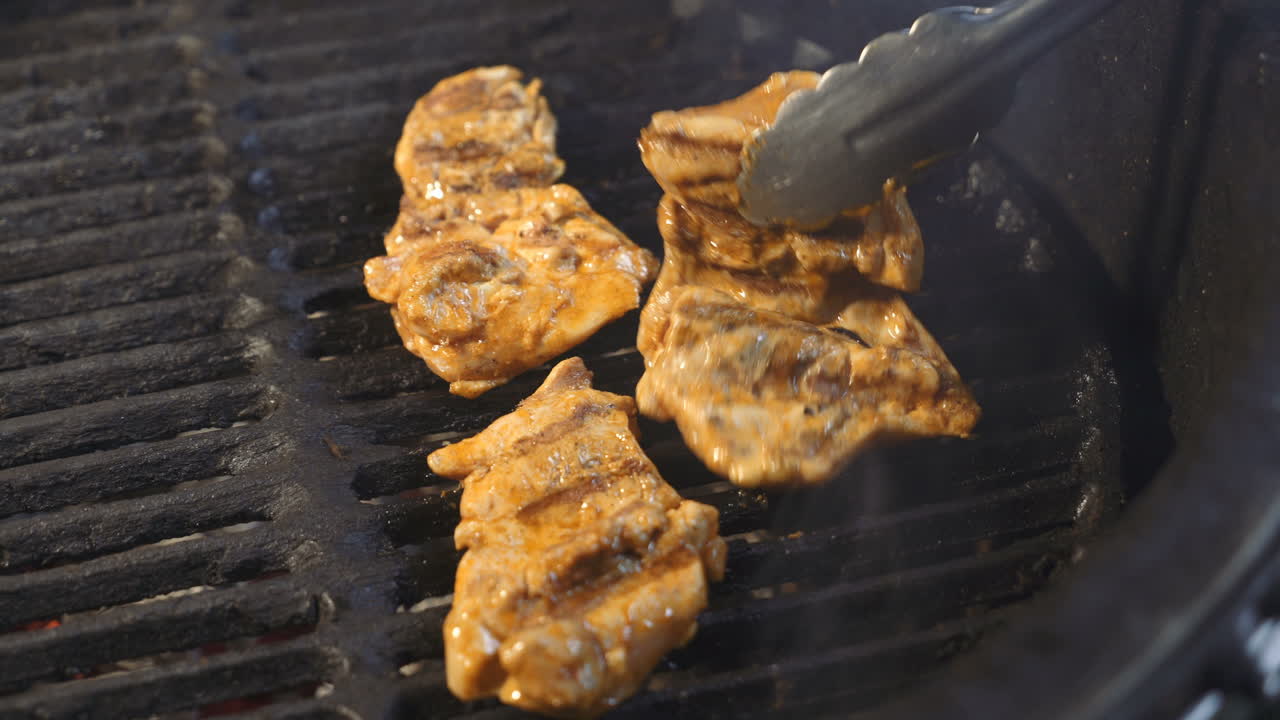 Preparation of delicious succulent meat steaks on the grill. Barbecue from charcoal.