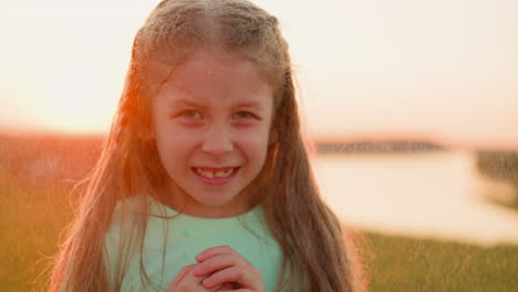 girl revels in cooling embrace of rain closeup child excitement for rain grows with laughter ringing