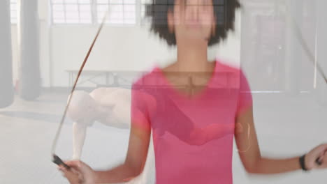 jumping rope, person over another doing push-ups in gym with animation