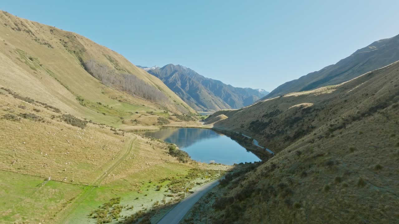 Aerial drone view of Moke Lake nestled amongst rugged, wild mountainous landscape in Otago, South Island of New Zealand Aotearoa