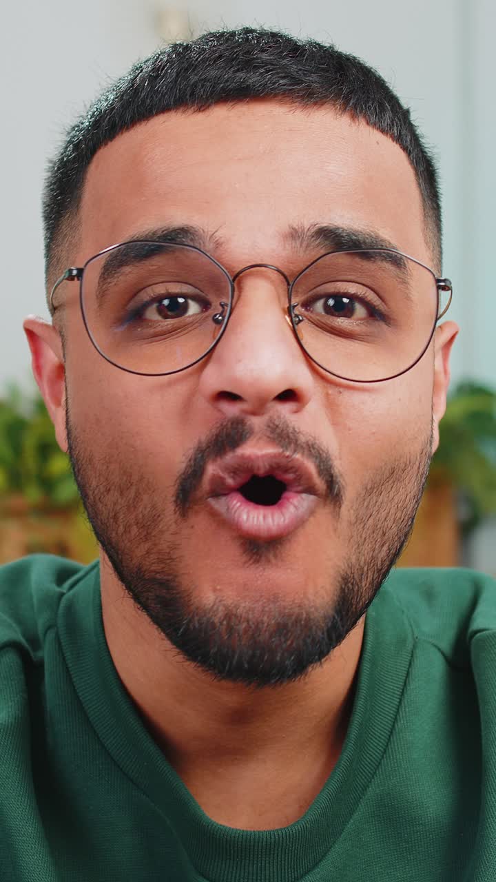 Excited arabian man surprised shocked by sudden victory good win news celebrating wow reaction