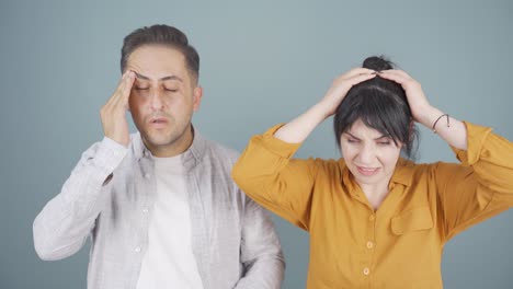 couple experiencing headache.