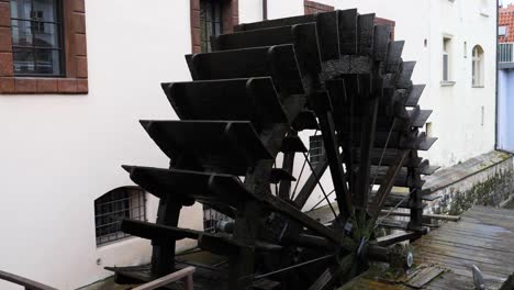 huge wooden wheel of grand priory mill prague, czech republic