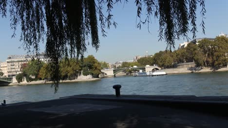 timelapse of paris, france over the boats on seine