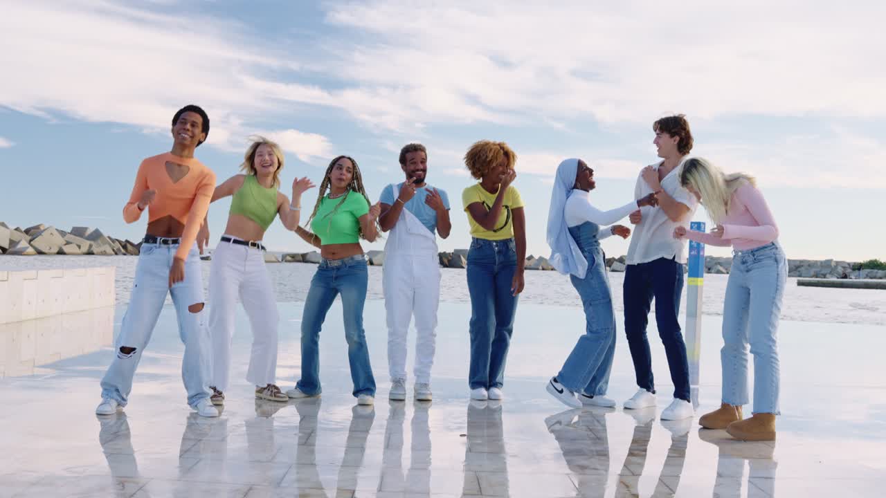 Group of Diverse Young People Dancing Together Outdoors