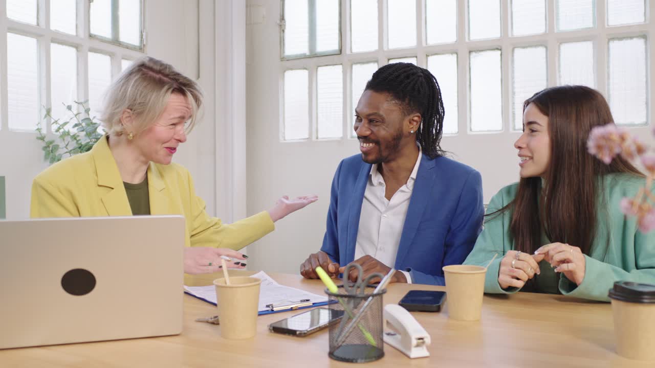 A group of colleagues collaborating in an office setting