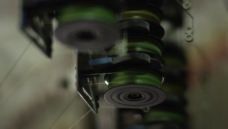 spinning thread roller on an automated cotton textile knitting machinery in a factory in china