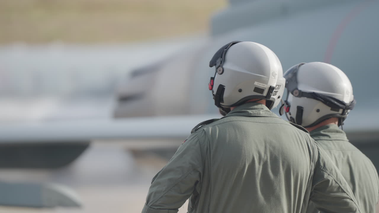 Two Pilots near an Aircraft