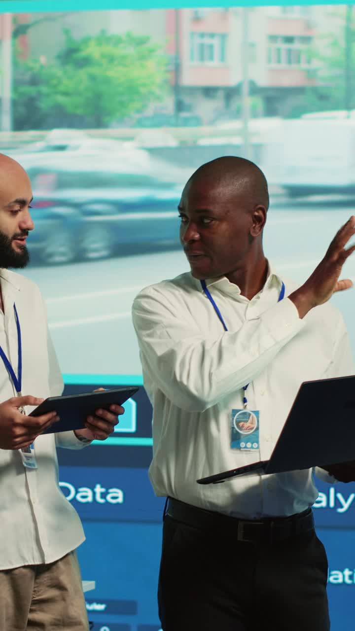 Two Diverse Businessmen Discussing Project in Office