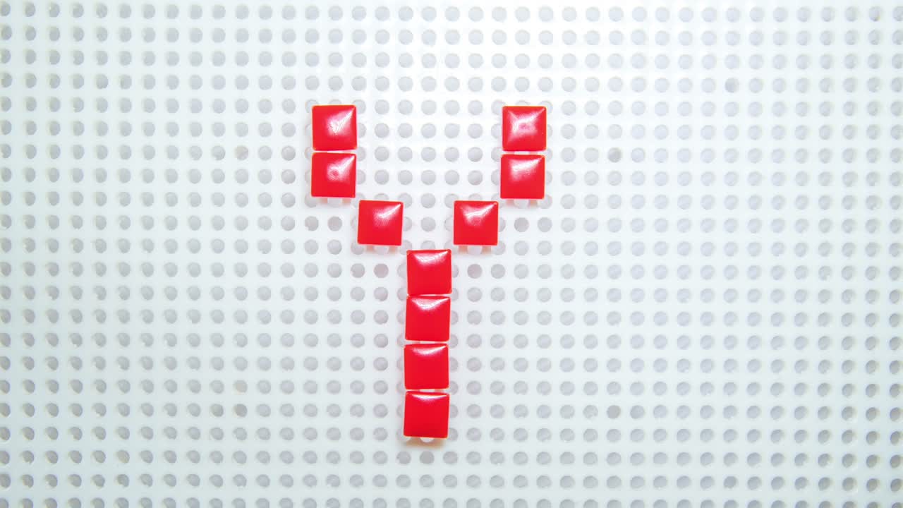 어린이 장난감으로 만든 한 번에 하나의 픽셀을 만드는 문자 y의 정지 동작