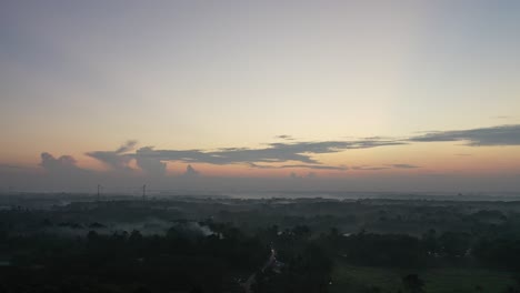 sunrise over a misty landscape