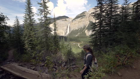 hiking to a majestic waterfall in the canadian mountains