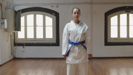 front view of girl doing defensive pose to the left and to right