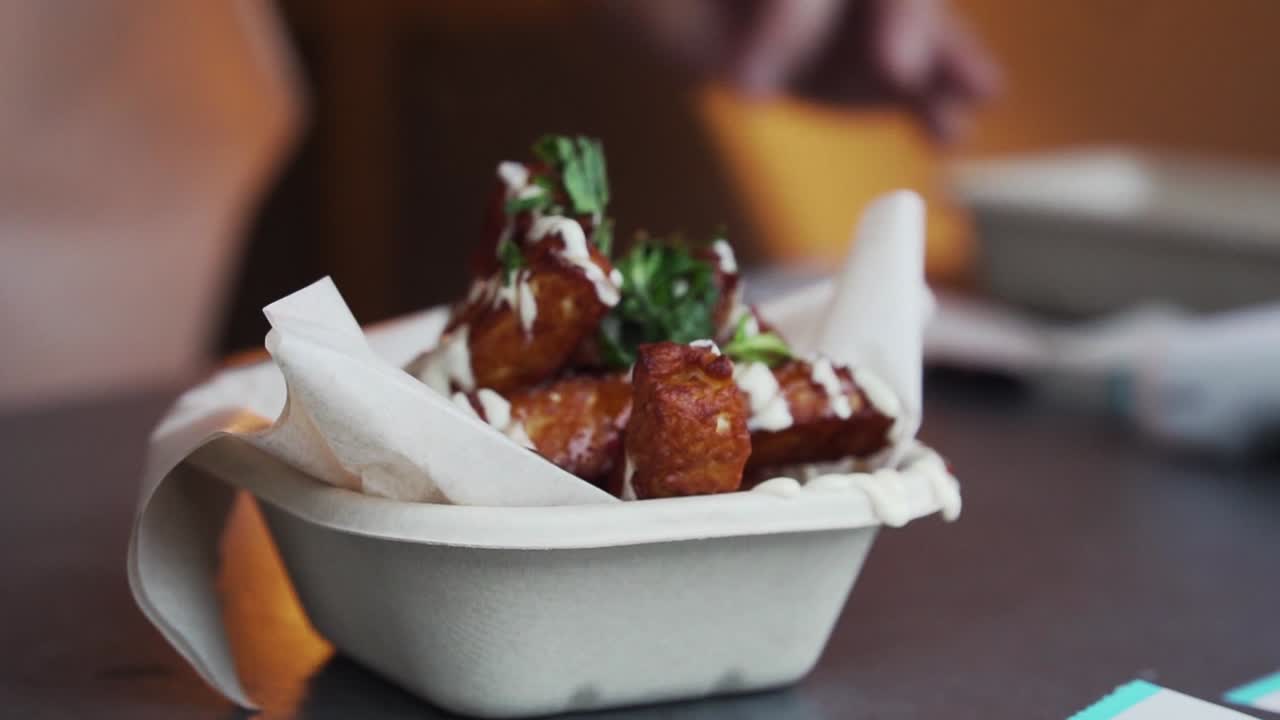 Portion of halloumi fires ready to be served from kitchen food truck