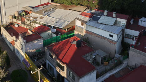 static drone timelapse over tin roofs in mexico city slum neighborhood