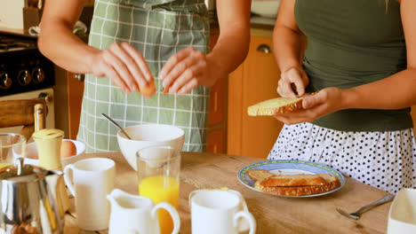 couple preparing breakfast in kitchen at home 4k