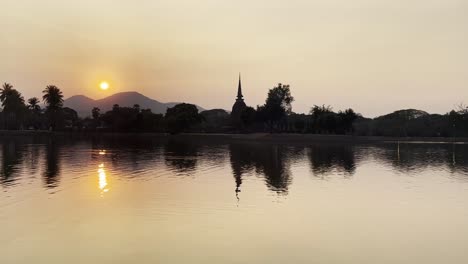 sunset silhouette of sukhothai thailand historical park, ancient ruins pagoda and temple buddhist cultural unesco heritage