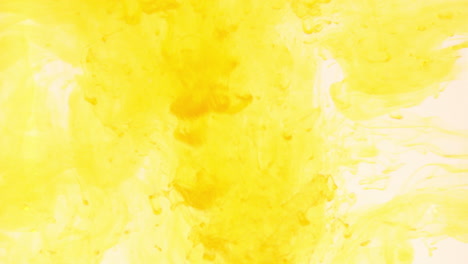 yellow food coloring dropping in water