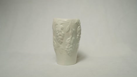 completed bespoke clay vase handmade with grape outline