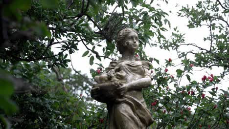 sculpture of a woman in the garden