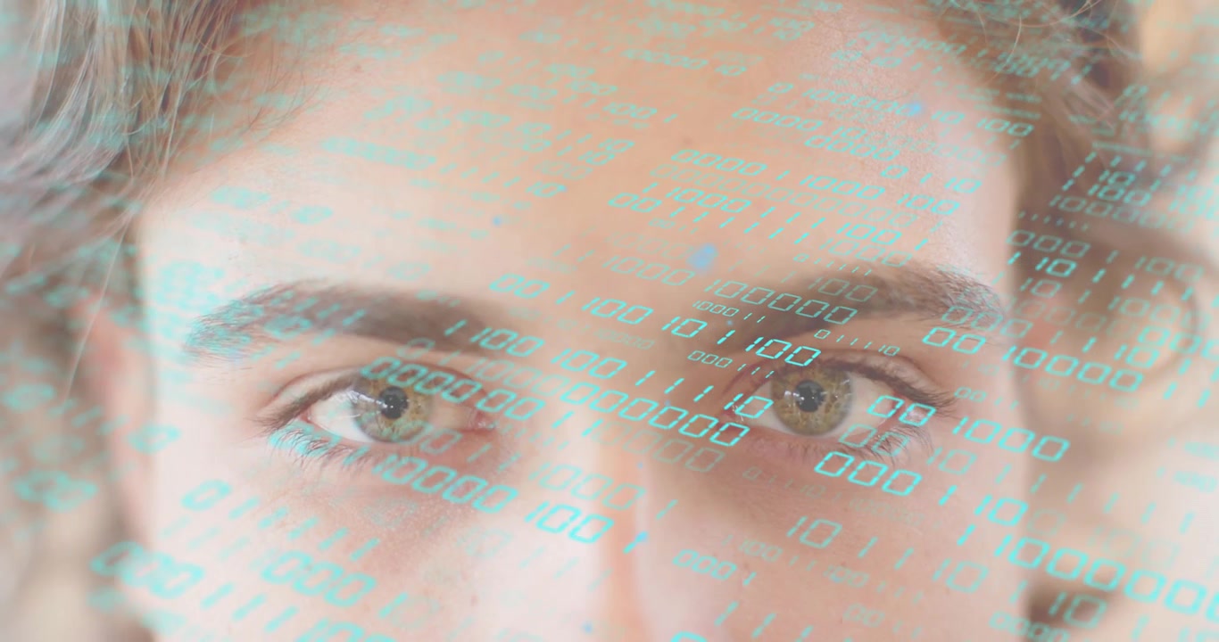 Woman opening eyes under binary streaming overlay and facing data merge indicating tech integration