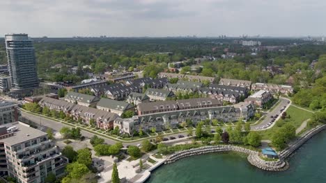 Drone-zooming-in-on-townhouses-on-the-shore-of-Lake-Ontario-in-Mississauga