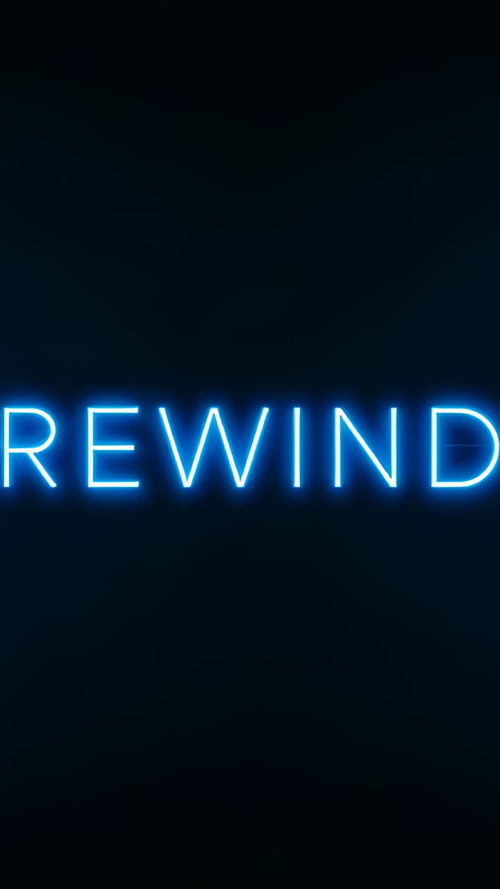 Vertical video: Frame showing blue neon REWIND pulsing on dark backdrop, halo and sparks for loop